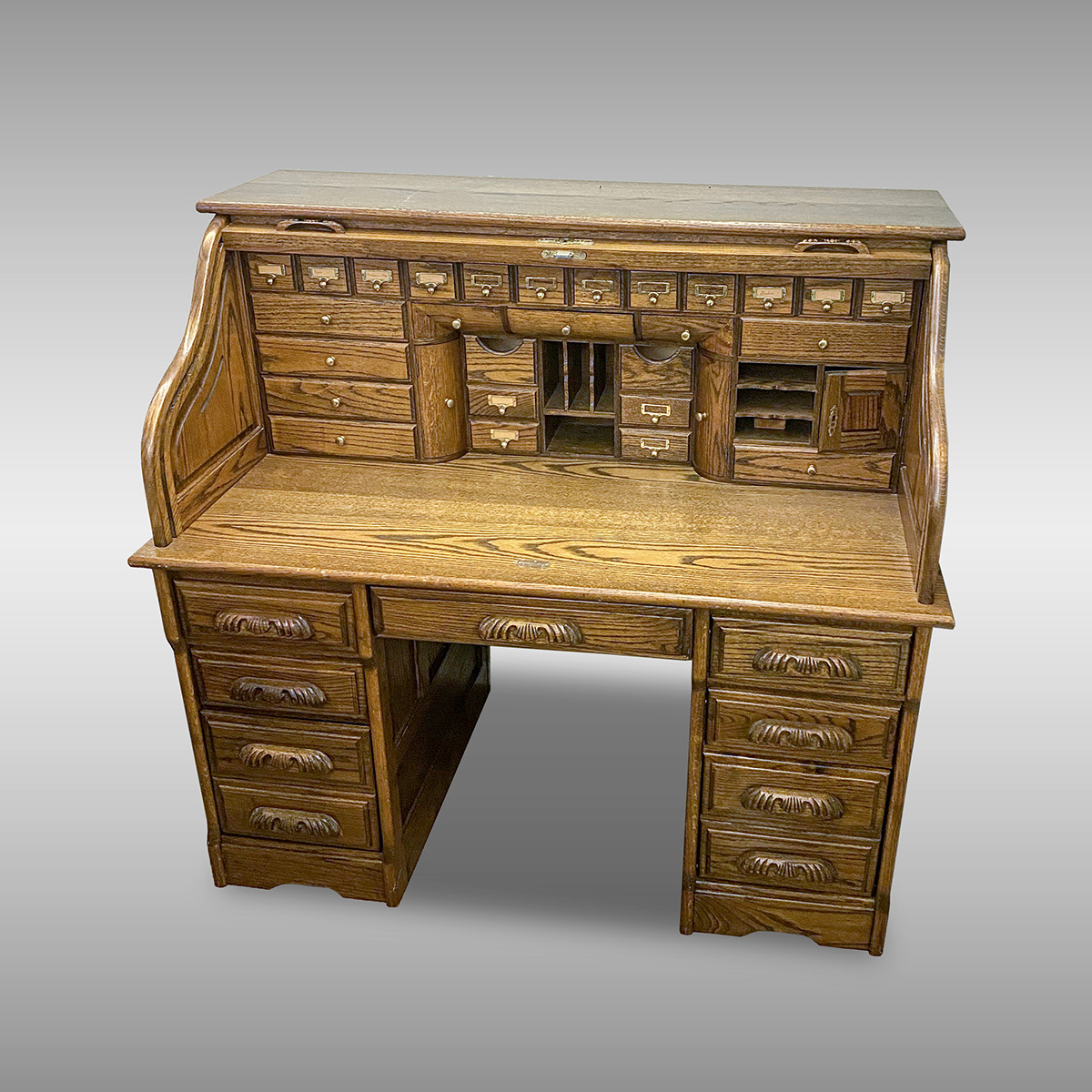 Appraisal: GOLDEN OAK S-ROLL DESK Golden Oak S-roll top desk having