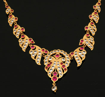 Appraisal: CT GOLD ARTICULATED COLLAR SET WITH SYNTHETIC RUBIES AND SAPPHIRES