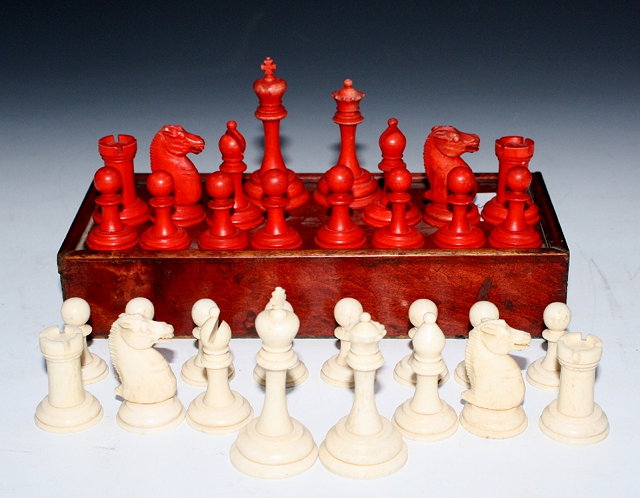 Appraisal: A TURNED AND STAINED STAUNTON STYLE BONE CHESS SET cm