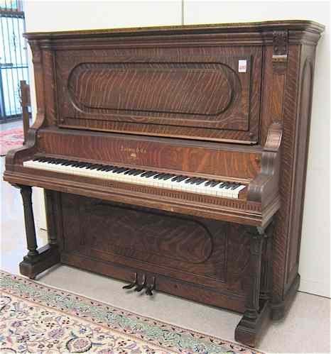 Appraisal: AN AMERICAN OAK UPRIGHT GRAND PIANO Ludwig Co New York