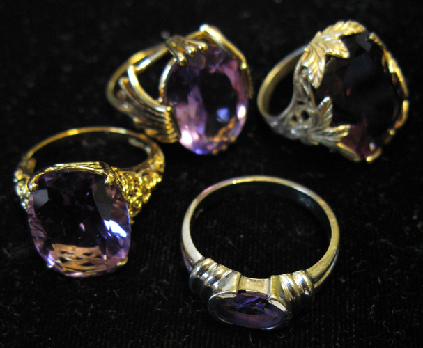 Appraisal: FOUR AMETHYST AND GOLD RINGS one K yellow gold and