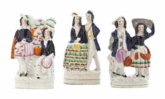 Appraisal: Three Staffordshire Figural Groups each depicting a lady and a