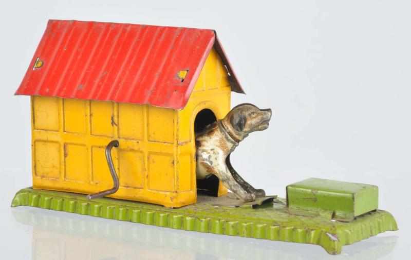 Appraisal: Tin Litho Dog in Doghouse Penny Toy German Crank-operated Some