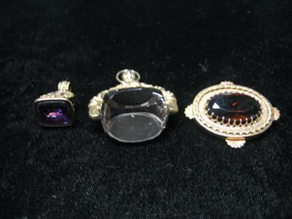 Appraisal: Two watch fobs and one small brooch Watch fobs set