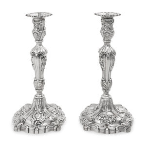 Appraisal: A Pair of Silver Candlesticks th Century weighted with applied