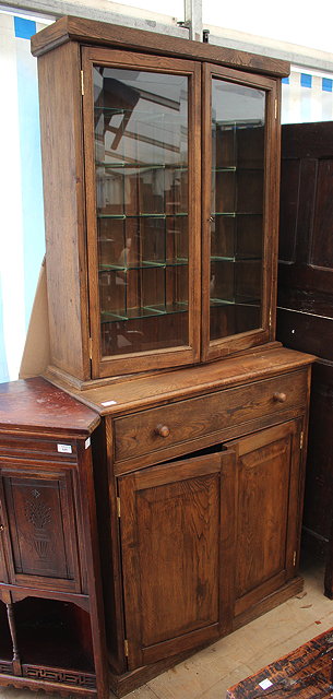 Appraisal: A GLASS MOUNTED CABINET with two short drawers and three