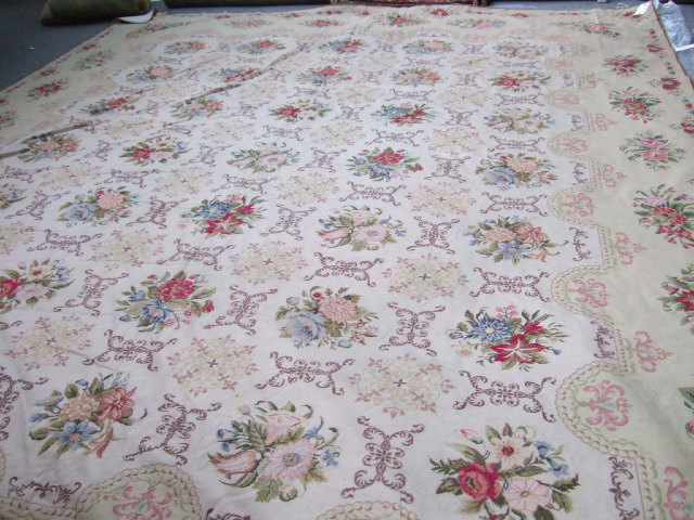 Appraisal: An Aubusson carpet the cream field with rows of boutique