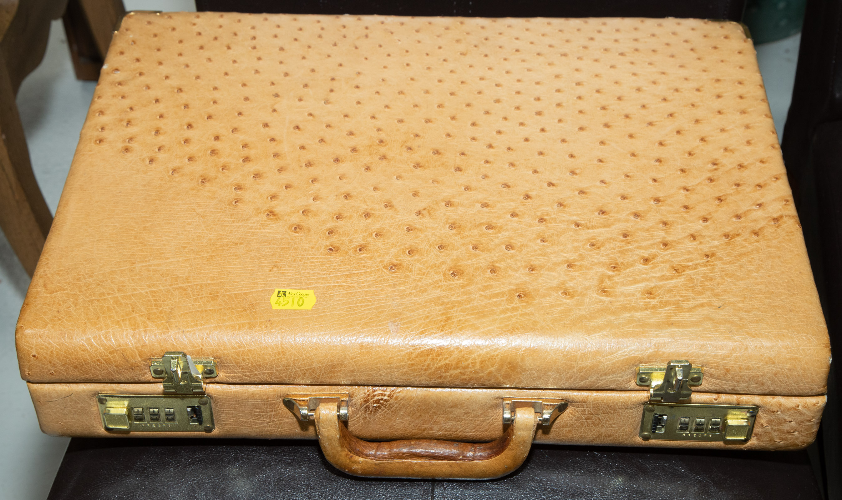 Appraisal: KWA WINNER OSTRICH LEATHER BRIEFCASE Modern with gilt-metal fittings leather