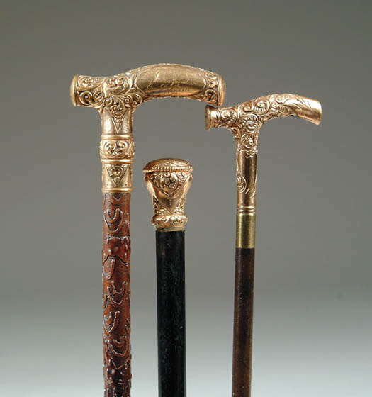 Appraisal: THREE GOLD HANDLED CANES - gold filled T-handle with scroll