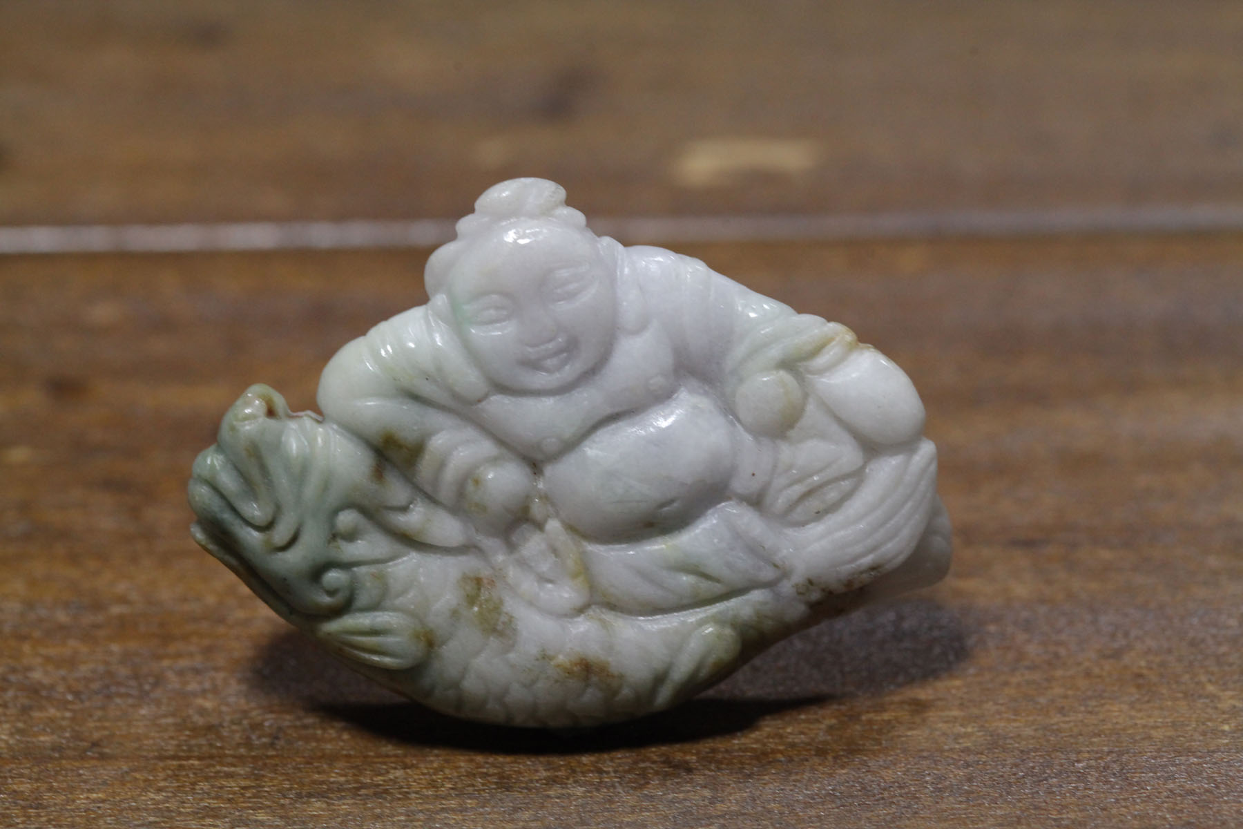 Appraisal: CARVED STONE Asian th century probably jade Lavender Buddha on