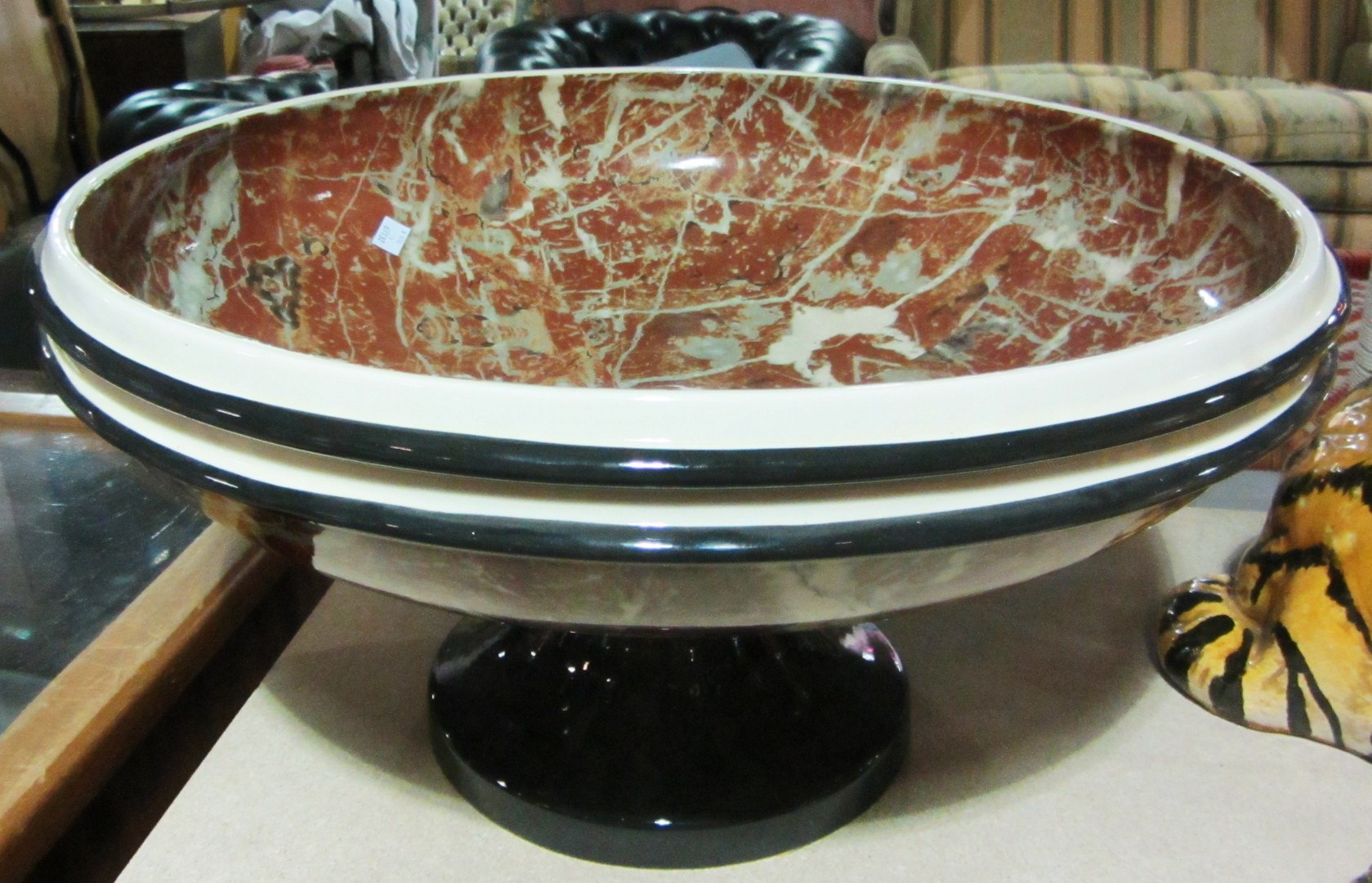 Appraisal: A large faux marble pottery bowl