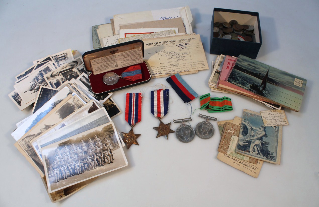 Appraisal: A set of World War II medals associated ephemera photographs