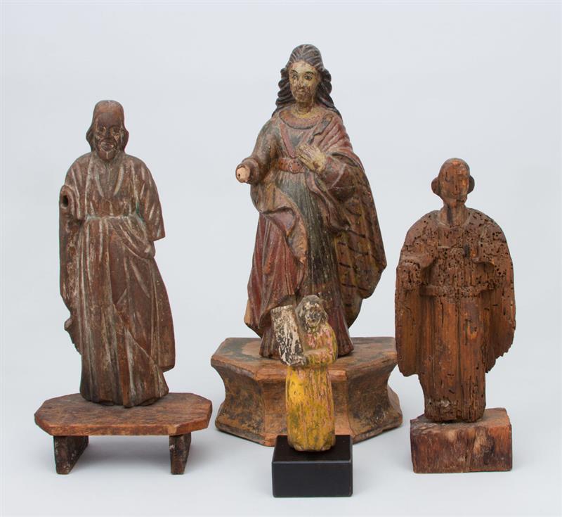 Appraisal: GROUP OF FOUR CARVED AND POLYCHROME WOOD SANTOS FIGURES and