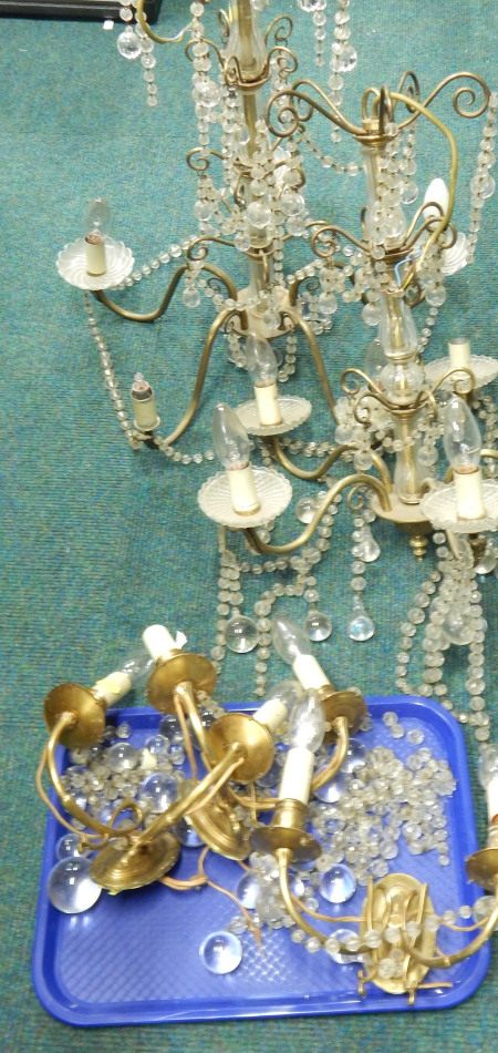 Appraisal: Two similar thC gilt brass chandeliers each with suspended drops