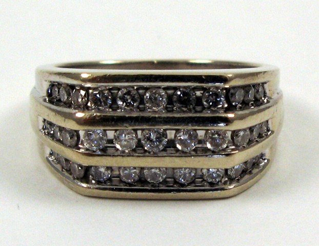 Appraisal: MAN'S DIAMOND AND FOURTEEN KARAT GOLD RING set with round-cut