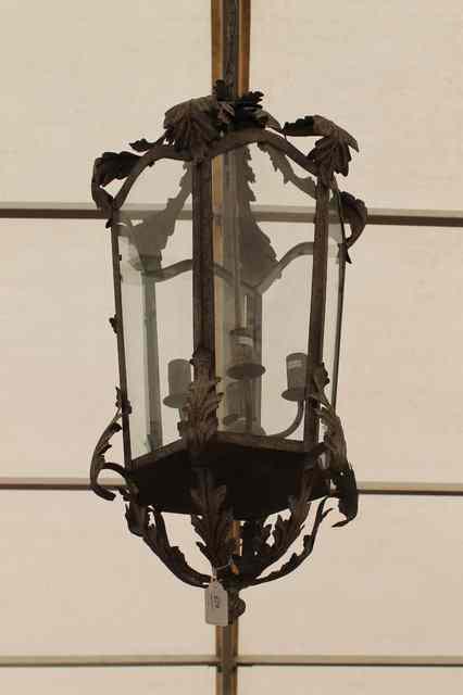 Appraisal: A PAINTED TIN HEXAGONAL HALL LANTERN with scrolling acanthus leaf