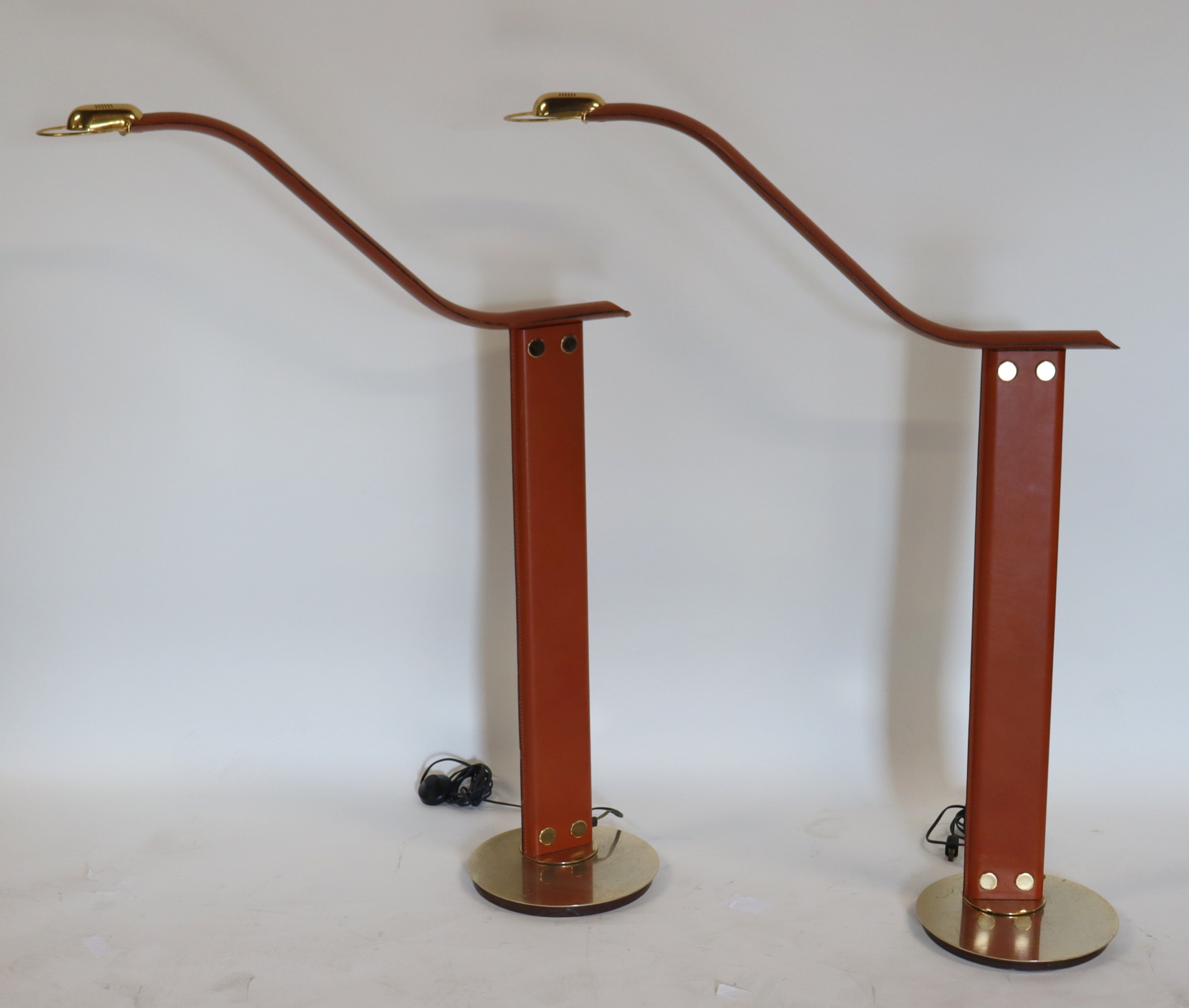 Appraisal: A PAIR OF ITALIAN LEATHER BRASS FLOOR LAMPS A pair