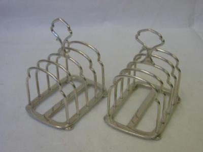 Appraisal: A PAIR OF TOAST RACKS with five shaped wirework divisions