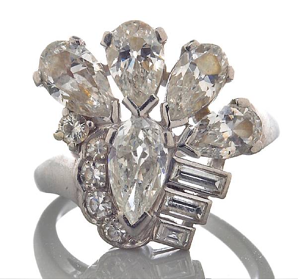 Appraisal: A diamond ring highlighting a spray of pear baguette and