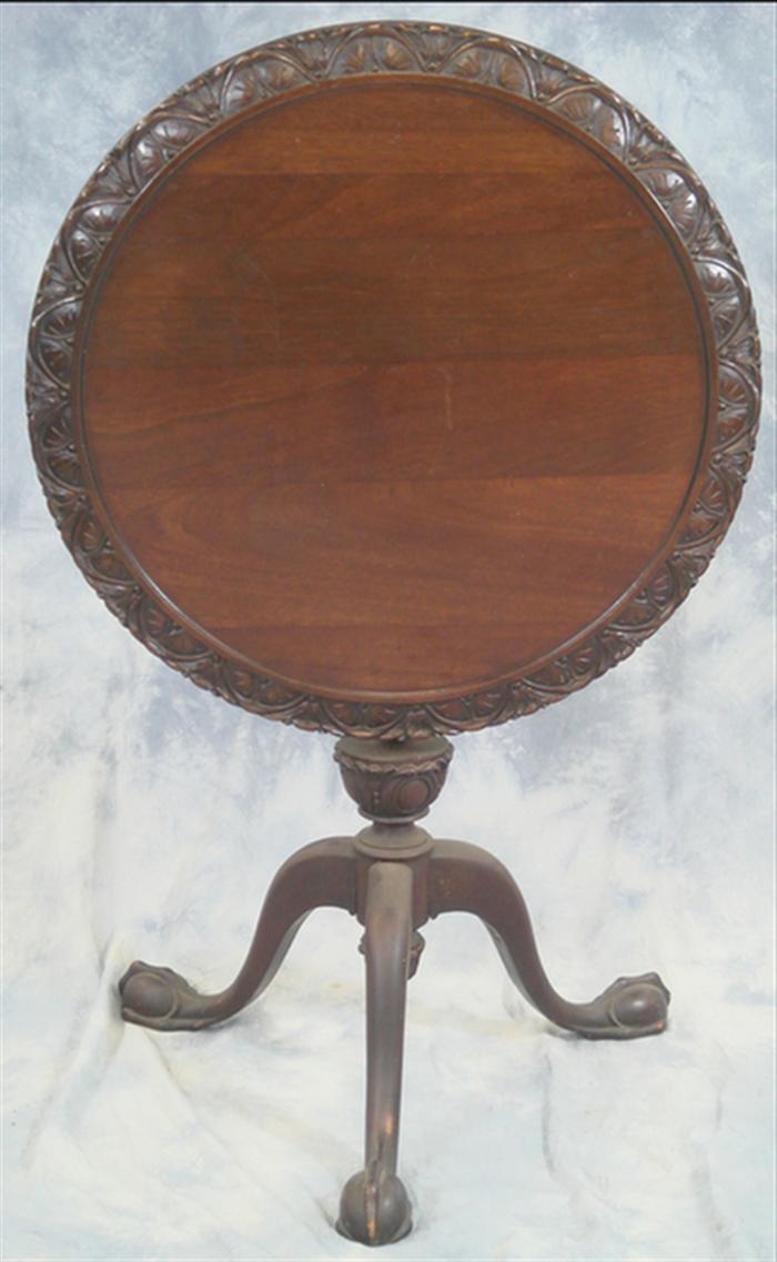 Appraisal: Carved mahogany style Chippendale tilt top table d x h