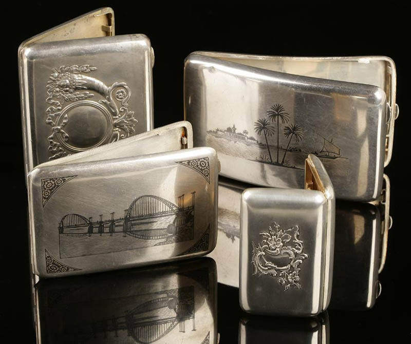 Appraisal: Four silver cigarette cases Russian Egyptian Four silver cigarette cases