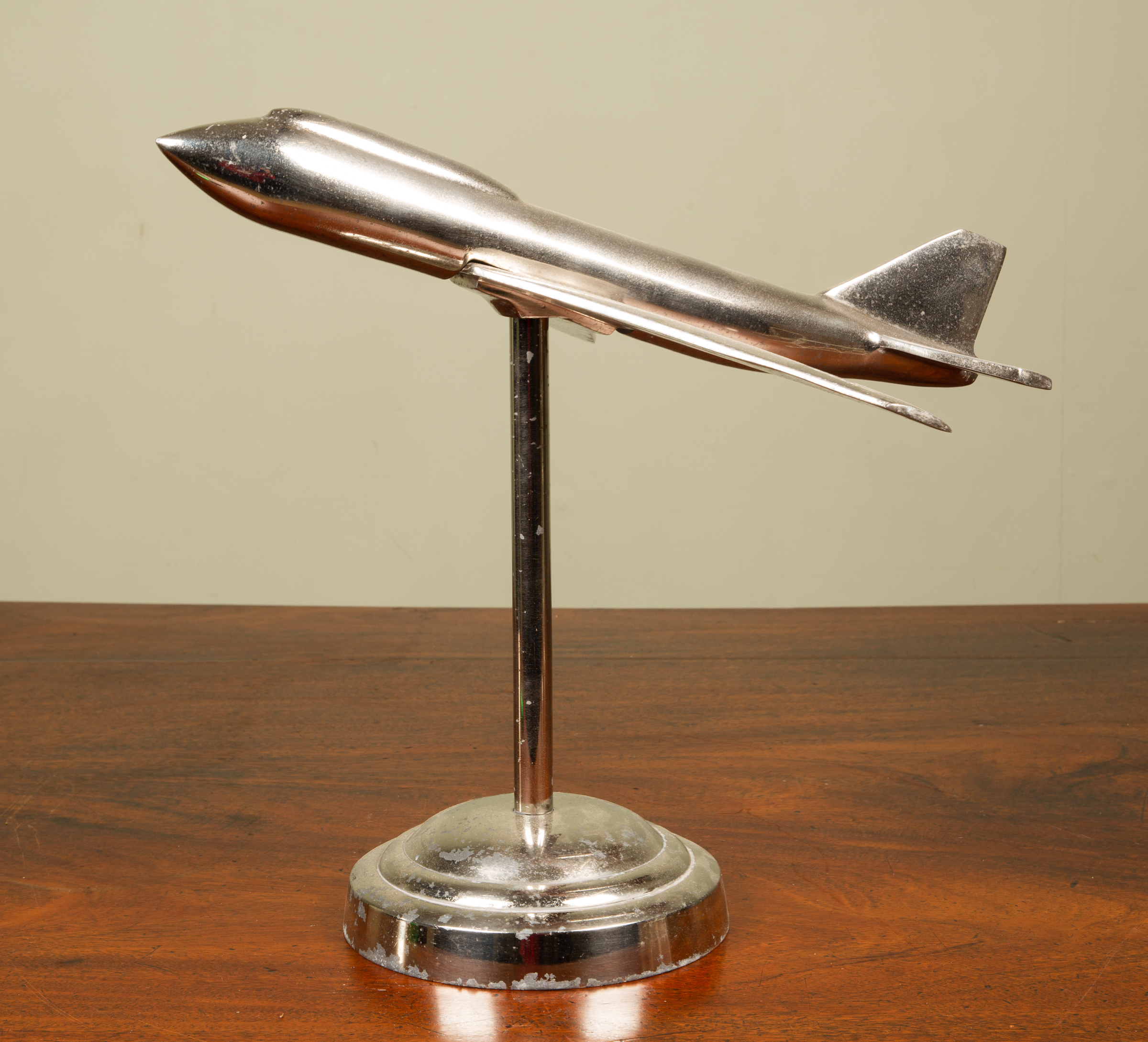 Appraisal: A decorative chrome plated desktop aeroplane model on a circular