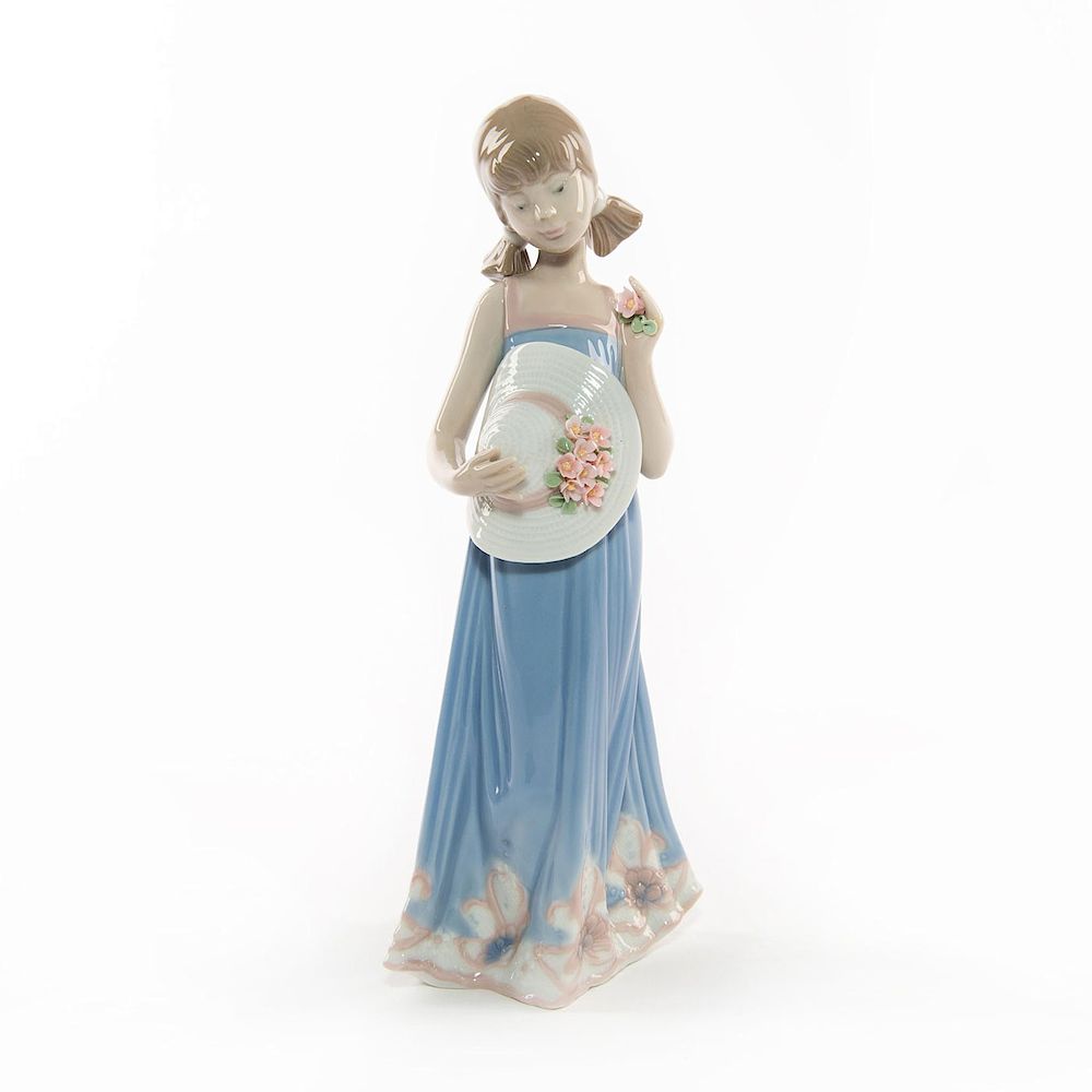 Appraisal: LLADRO FIGURINE COURTNEY Young girl holding hat with flowers Lladro