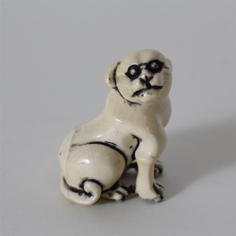 Appraisal: Japanese carved ivory netsuke dog figure H x W