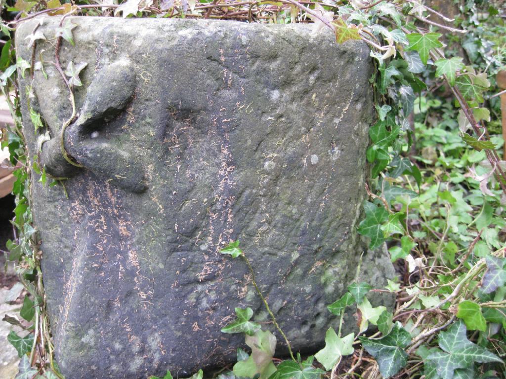 Appraisal: An early carved stone Mortar with star design on lugged