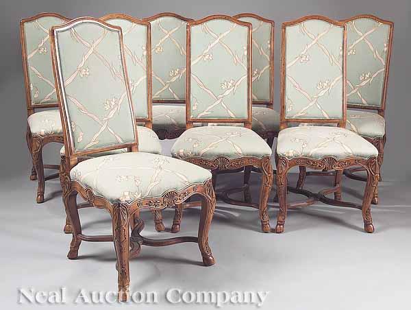 Appraisal: A Set of Eight French Provincial Carved Fruitwood Dining Chairs