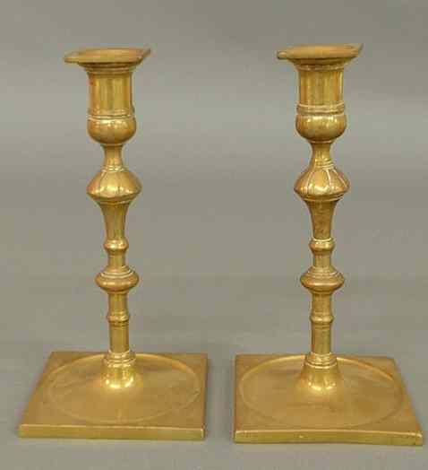 Appraisal: Pair of th c Continental brass candlesticks with square bases