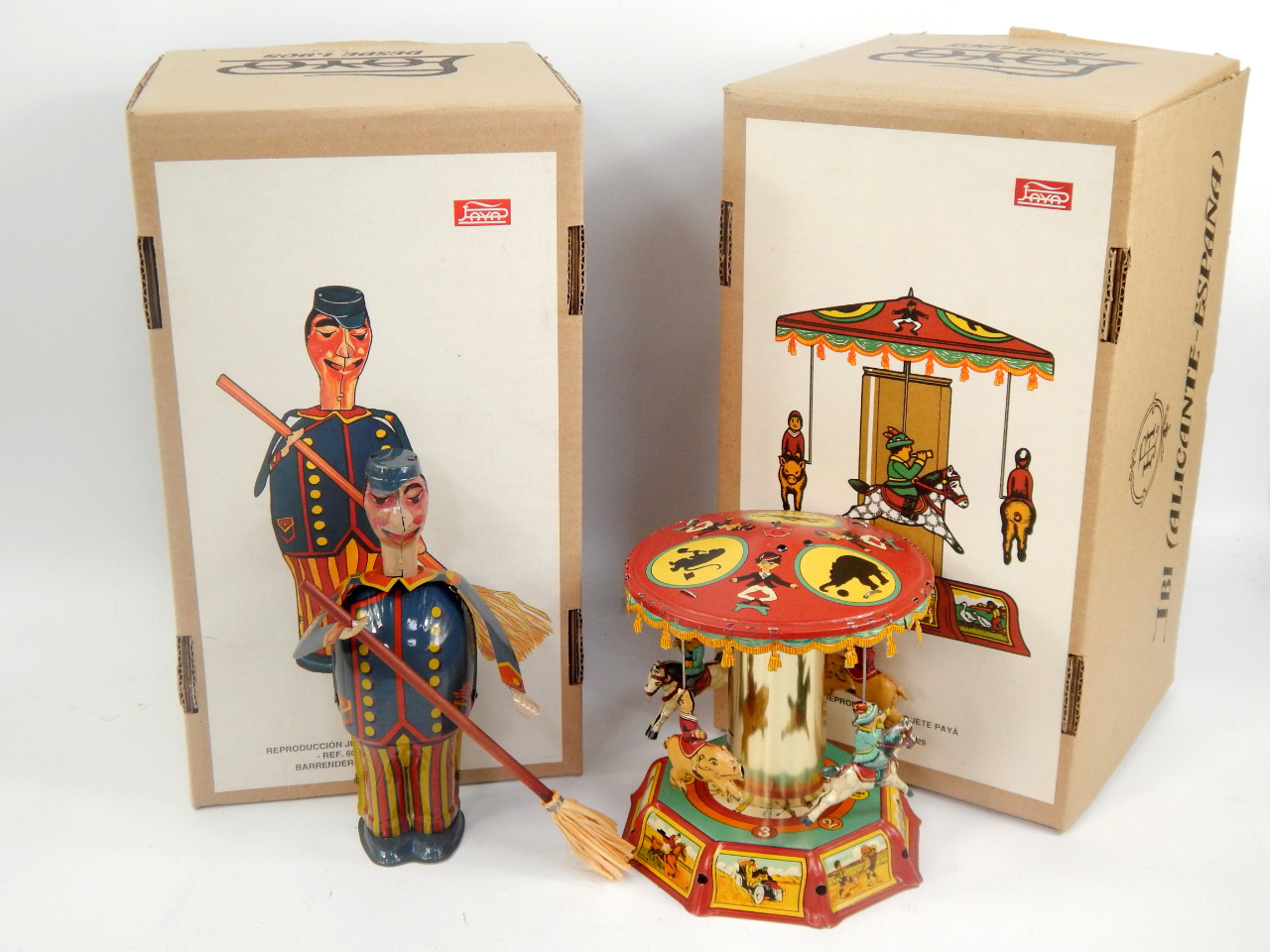 Appraisal: Two large Jaya tin plate toys comprising sweeping gentleman and