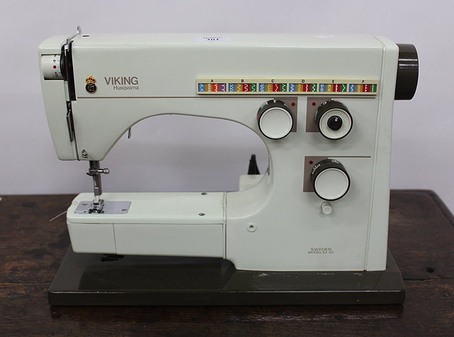 Appraisal: A SWEDISH VIKING HUSQVARNA MODEL SEWING MACHINE together with a