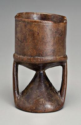 Appraisal: African wooden vessel cylindrical with openwork strap supports possibly for