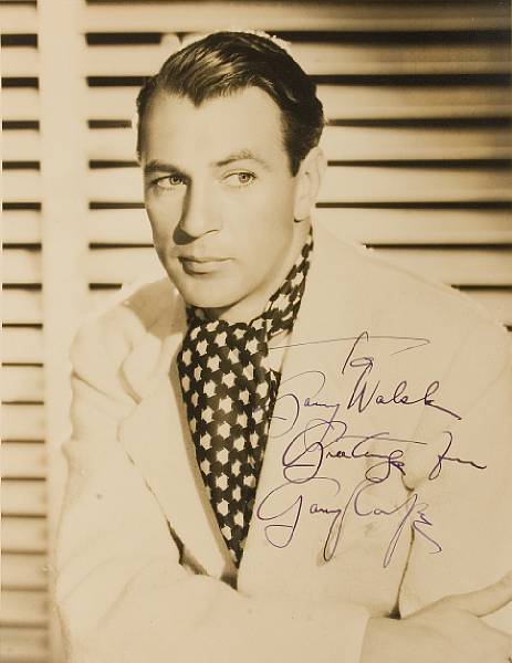 Appraisal: A Gary Cooper signed sepia photograph s A vintage print