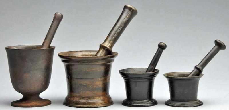 Appraisal: Lot of Cast Iron Bronze Mortars Pestles Description Circa -