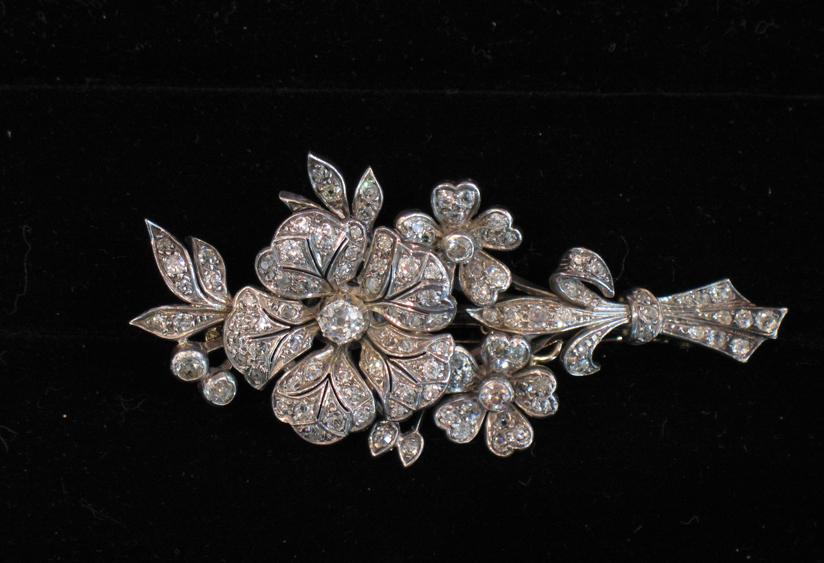 Appraisal: A DIAMOND-SET BROOCH in the form of a bouquet of