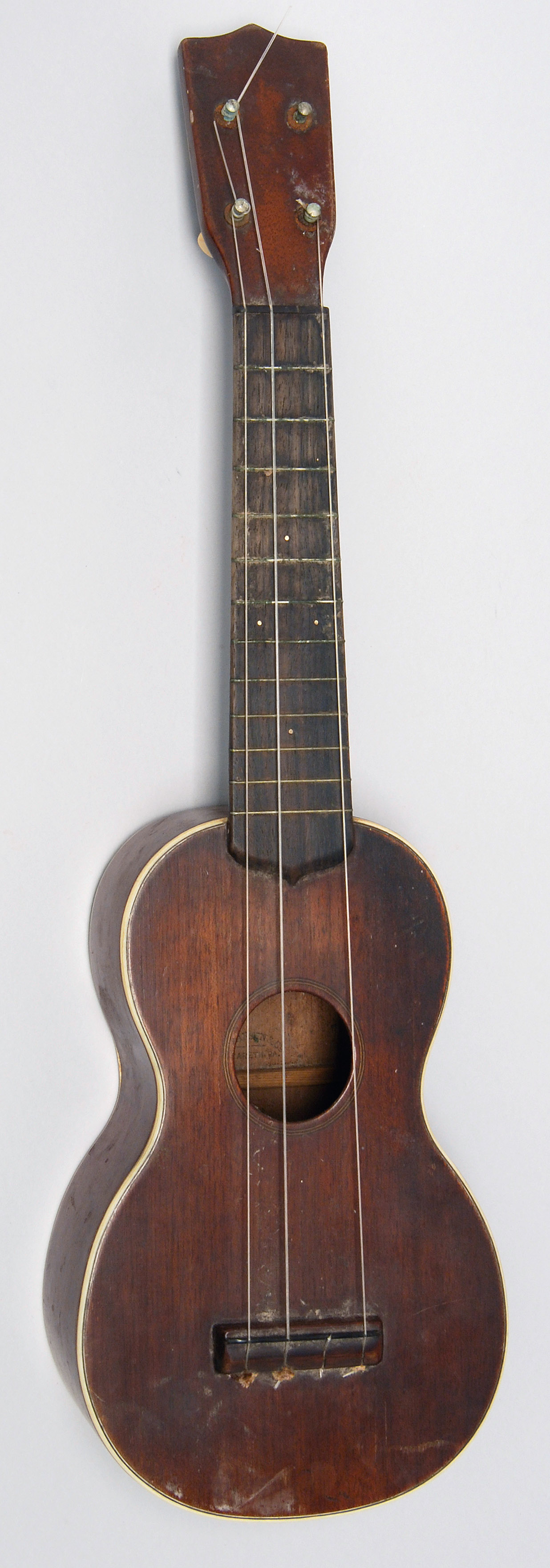 Appraisal: CIRCA OLIVER DITSON SOPRANO UKULELE Double bound mahogany neck and