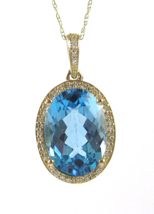 Appraisal: BLUE TOPAZ AND DIAMOND PENDANT NECKLACE suspended on a k