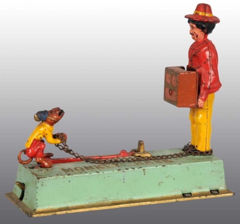 Appraisal: Cast Iron Monkey Bank Mechanical Bank Description Manufactured by Hubley