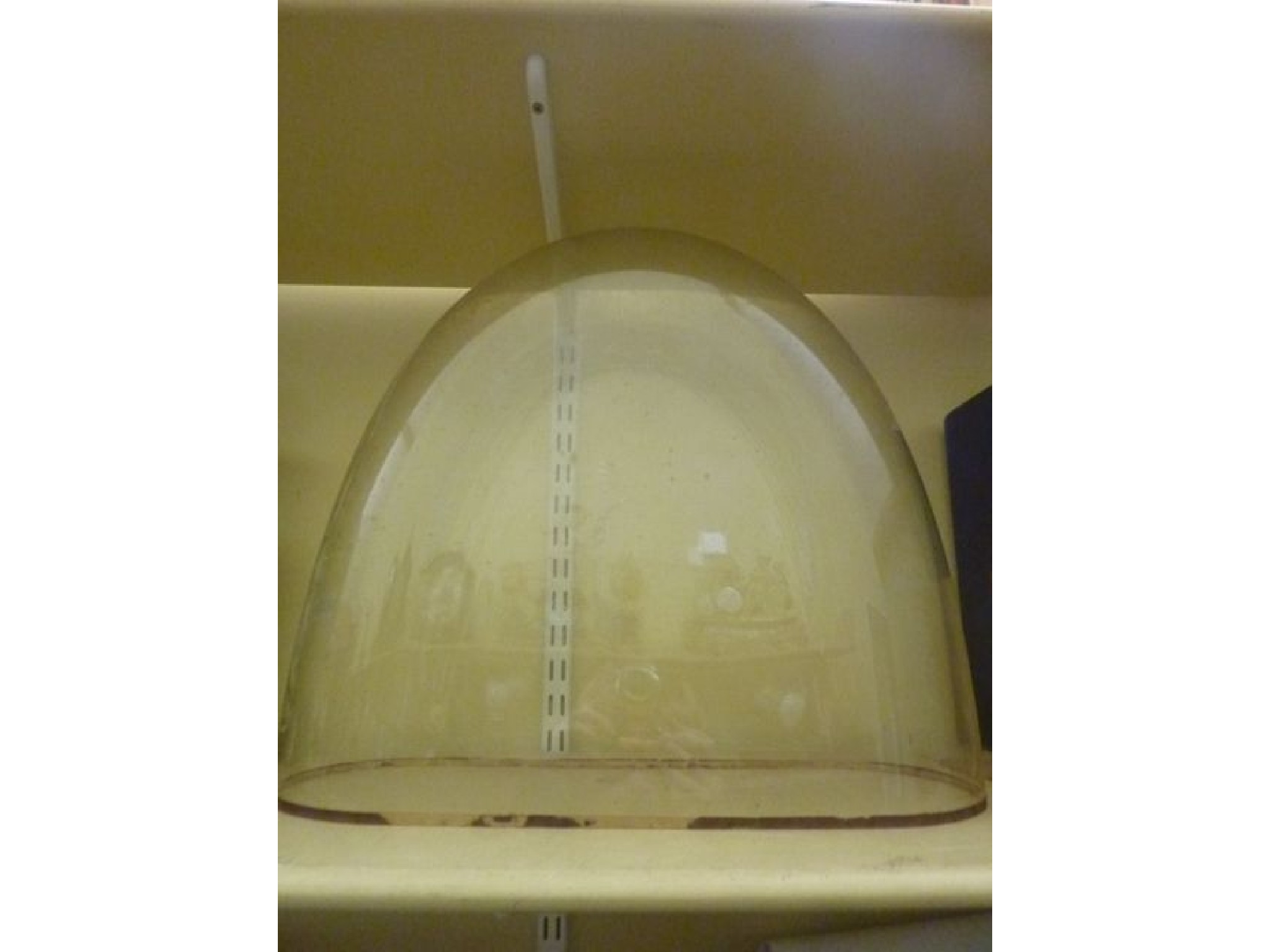 Appraisal: A glass clock dome cm in length x cm wide