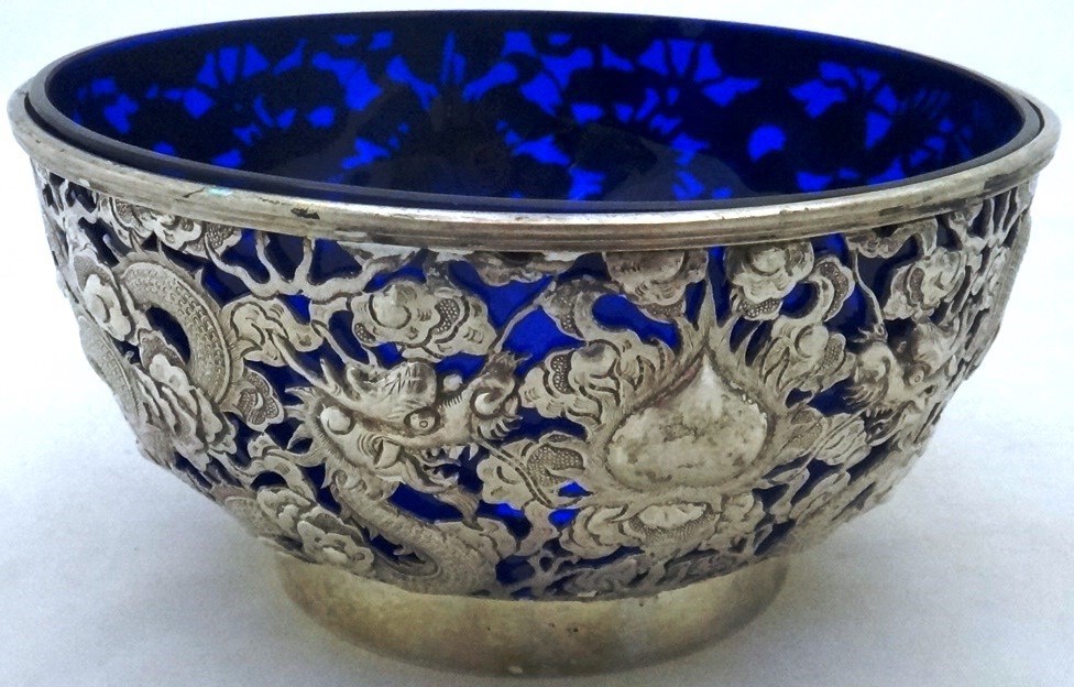 Appraisal: An Oriental circular bowl the body embossed and pierced with