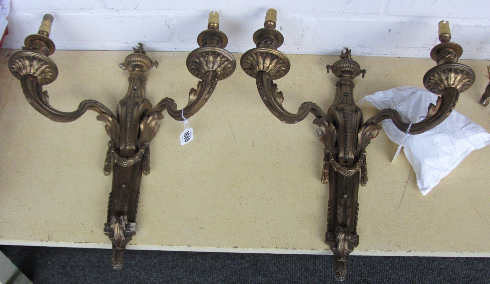 Appraisal: A pair of gilt bronze twin branch wall appliques of