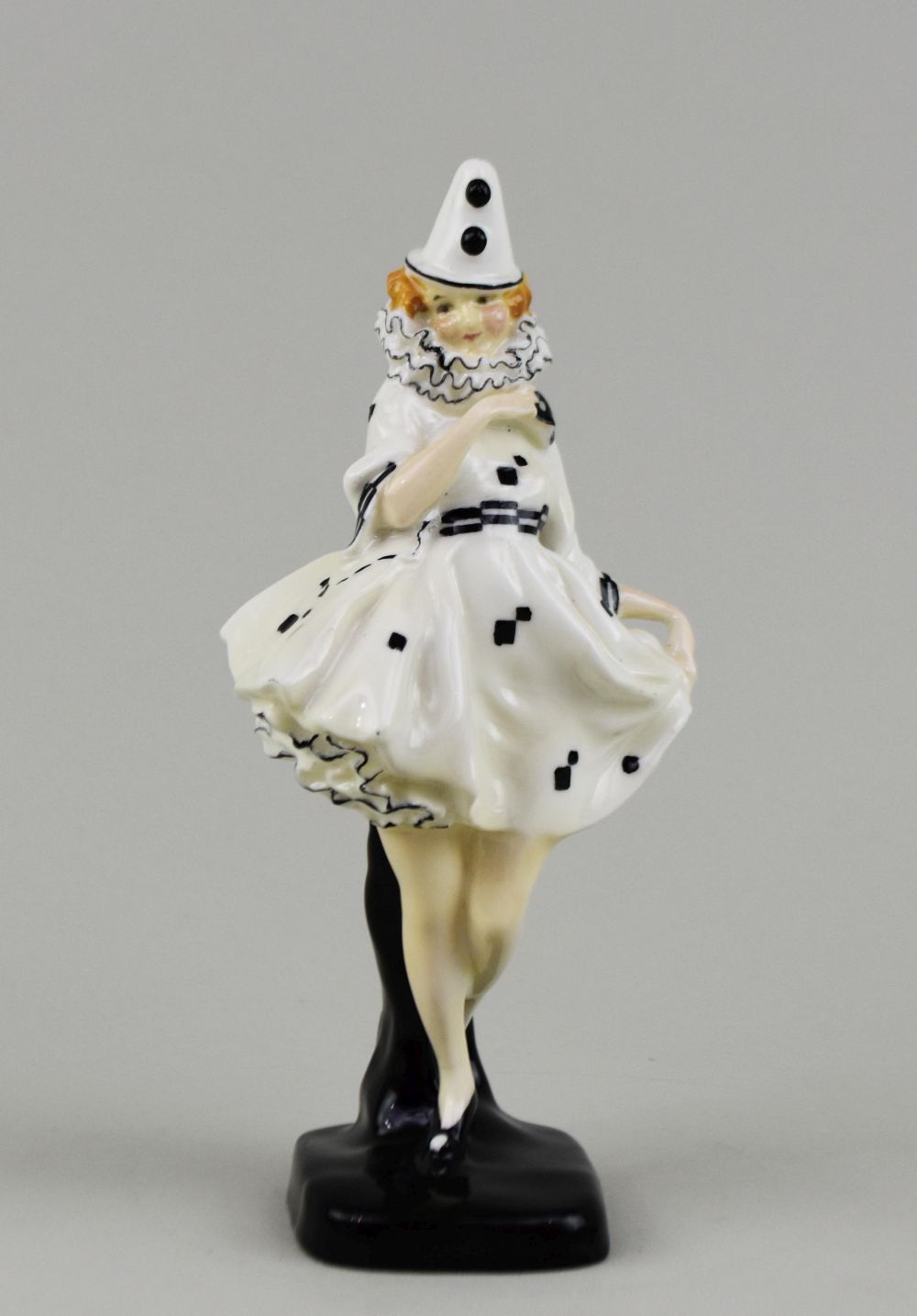 Appraisal: ROYAL DOULTON FEMALE HARLEQUIN DANCERThe underside with Doulton logo and