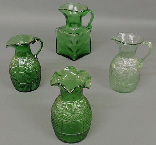 Appraisal: Four green glass pieces- two Clevenger pitchers square pitcher h