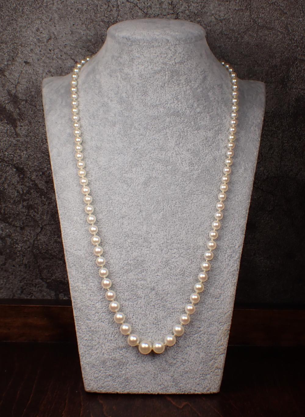 Appraisal: MATINEE LENGTH GRADUATED WHITE PEARL NECKLACE hand-knotted strand of well