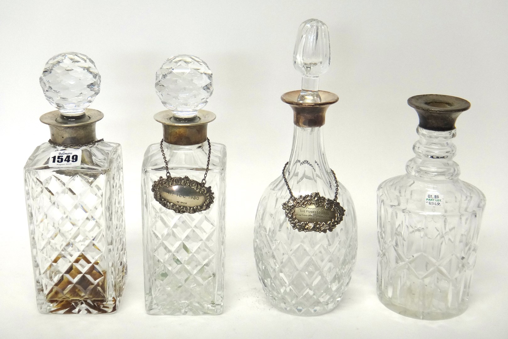 Appraisal: A pair of silvered mounted spirit decanters by J B