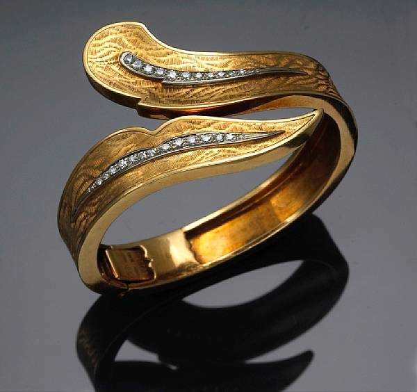 Appraisal: A diamond and eighteen karat gold bangle bracelet weighing approximately