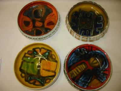 Appraisal: FOUR VARIOUS POOLE POTTERY BOWLS in Delphis design wide