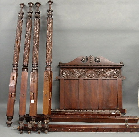 Appraisal: Empire carved mahogany bed with high posts and flame finials